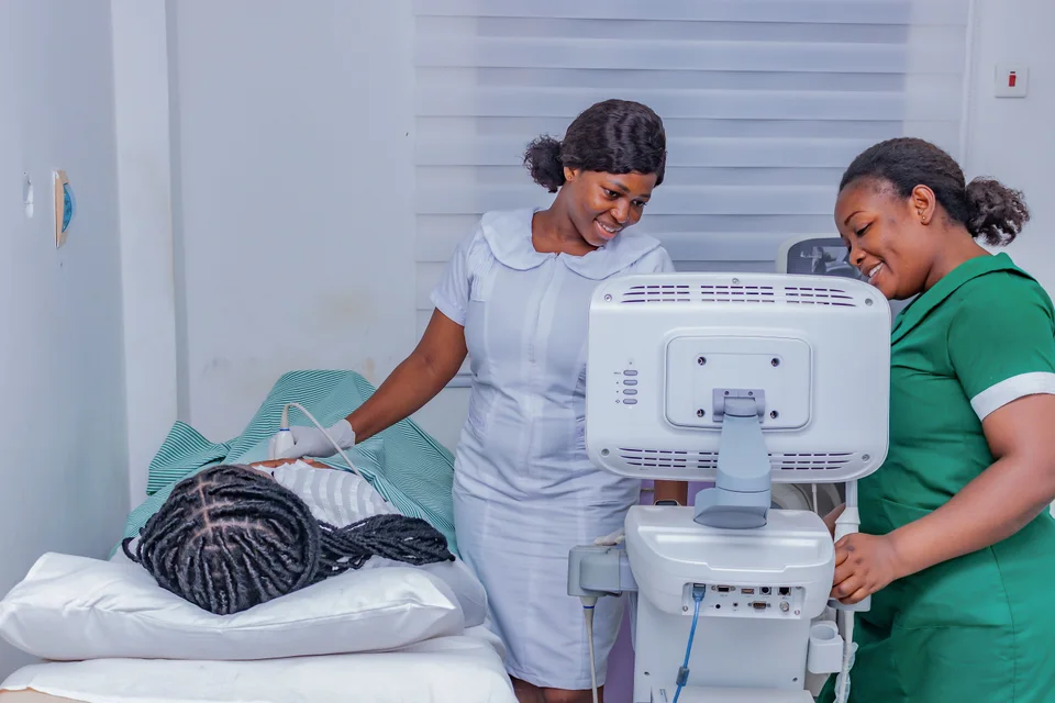 Healthcare professionals performing an ultrasound examination.